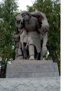 Скульптура «Девушка-санитарка, несущая раненого бойца» /  / Волгоградская область